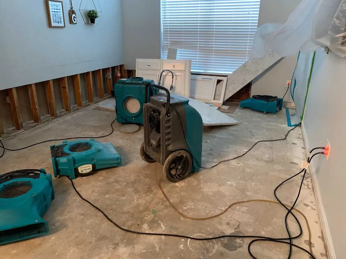 Dehumidifier in flood-cut room for Water Damage Restoration in Mims